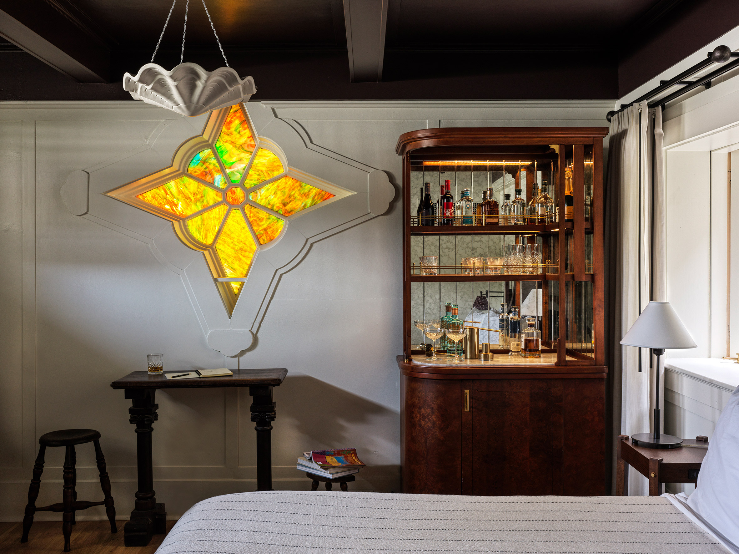 Guest room with a star-shaped stained glass window
