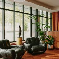 Floor-to-ceiling windows and seating in reception area of hotel Zurich