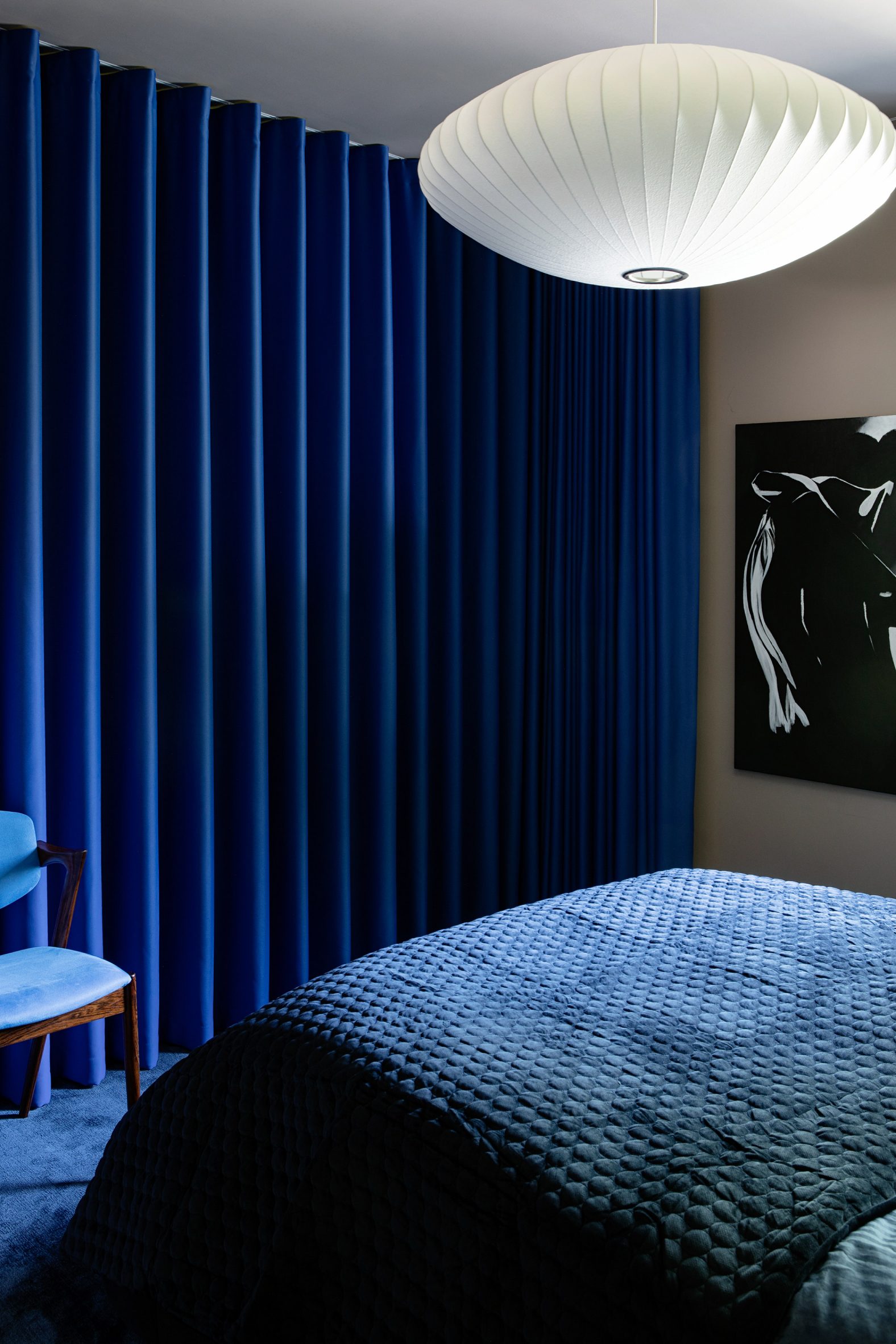 Deep blue-coloured guest bedroom by Kingston Lafferty Design