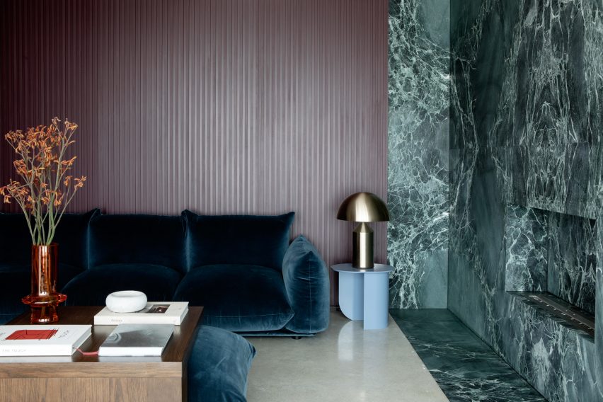 Living space with a green marble feature wall