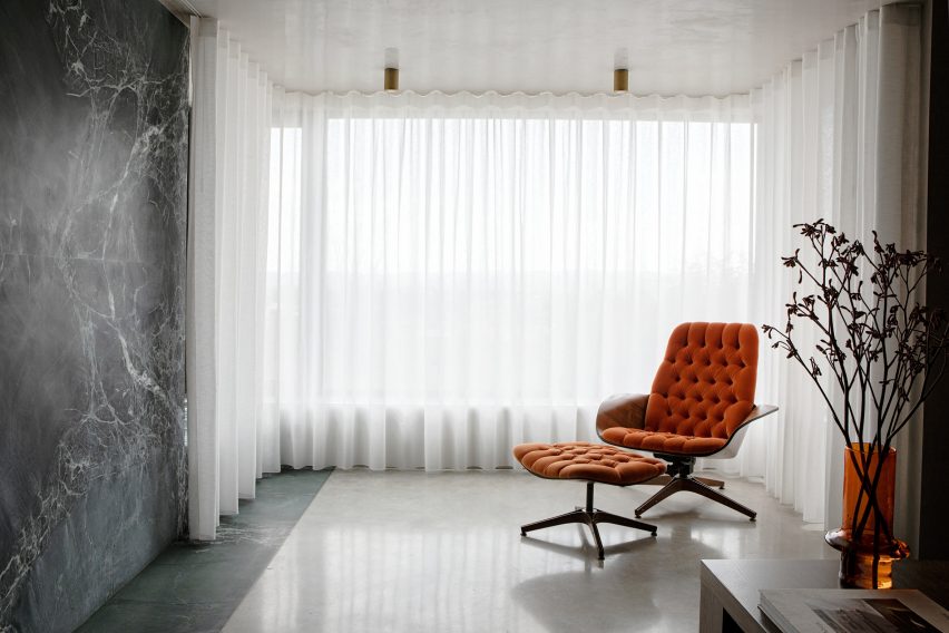 Living space with floor-to-ceiling curtains