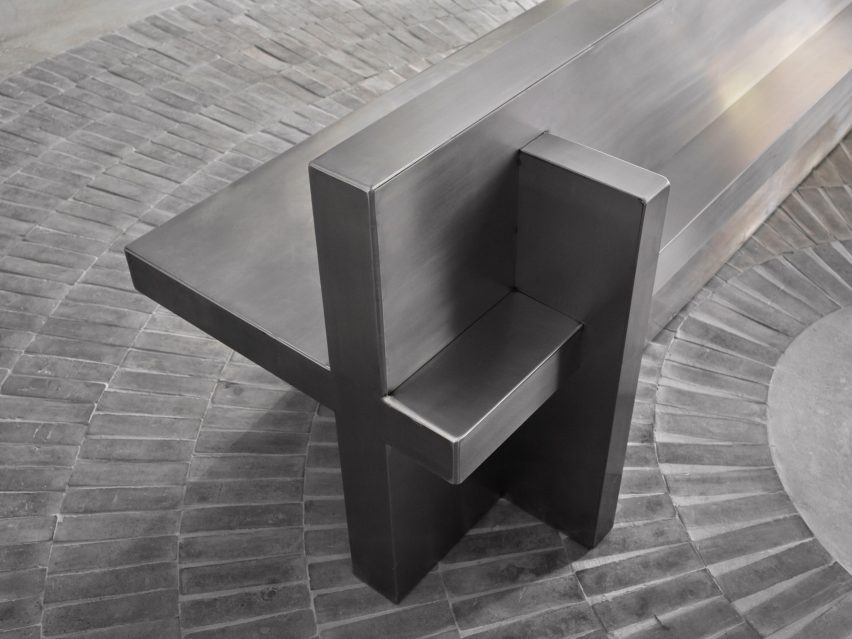Detail of a stainless steel bench made from perpendicular planes