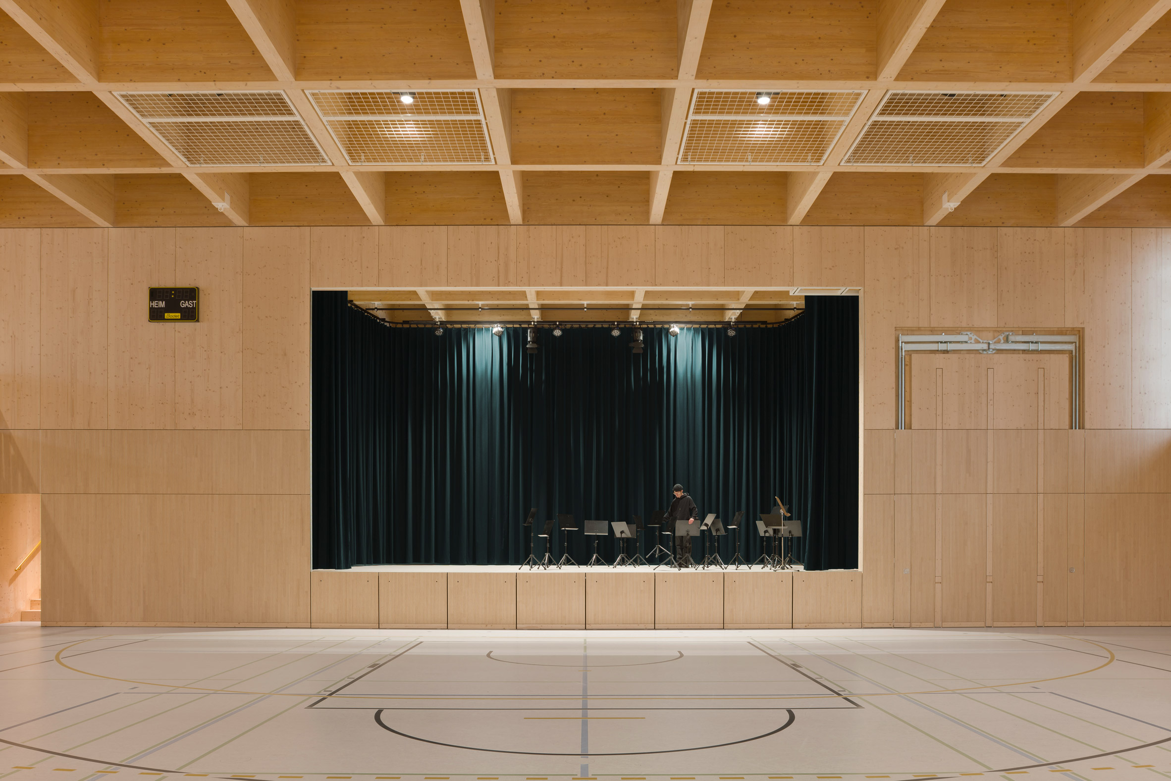 Performance stage in the timber-lined Markolfhalle Markelfingen hall by Steimle Architekten