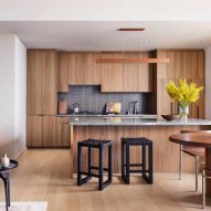 A kitchen with wooden cabintry