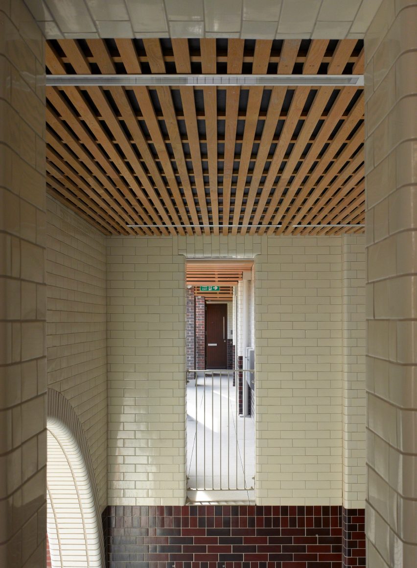 Internal walkway within London estate redevelopment by Matthew Lloyd Architects