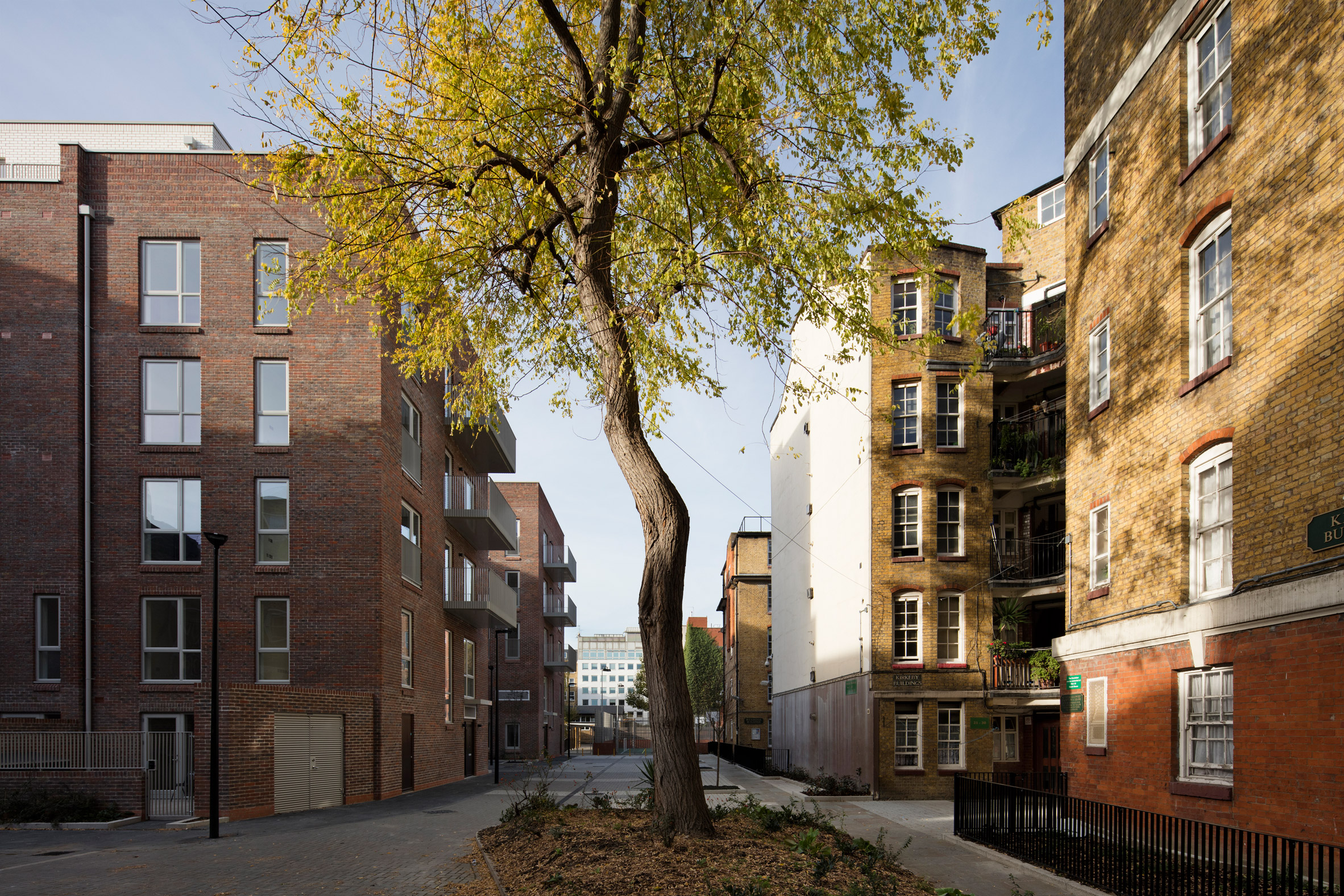 Street view of the social housing estate in London by Matthew Lloyd Architects