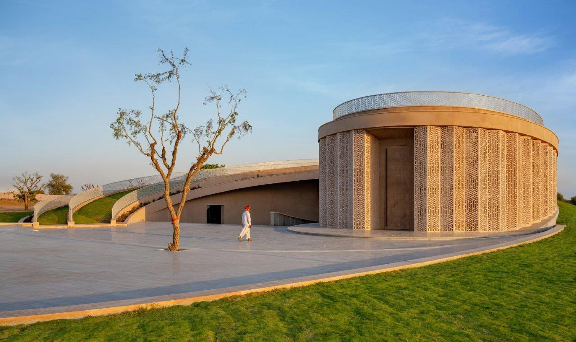 Perforated sandstone facade of Nokha Village Community Centre by Sanjay Puri Architects in India
