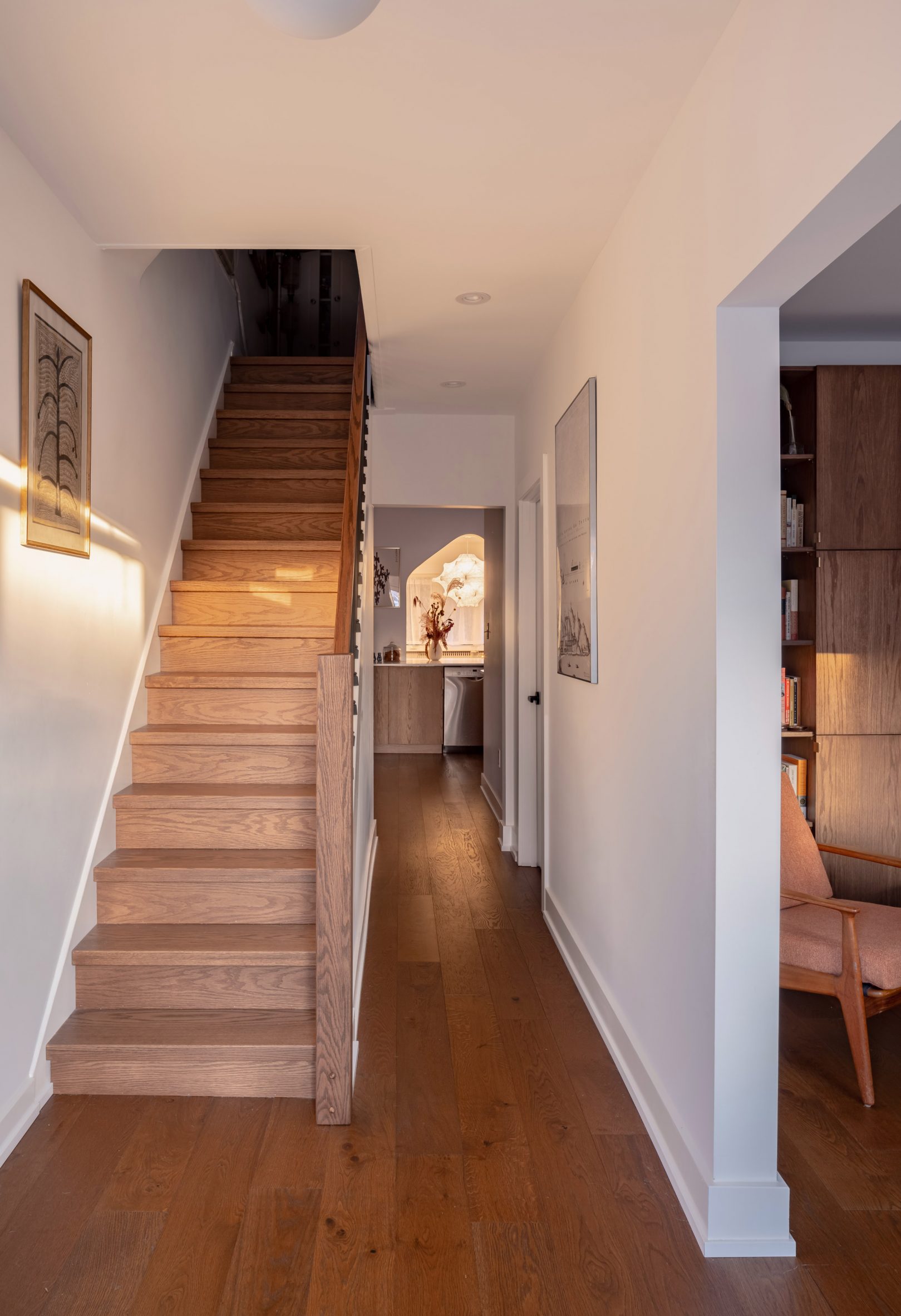Hallway with dark oak flooring and a staircase