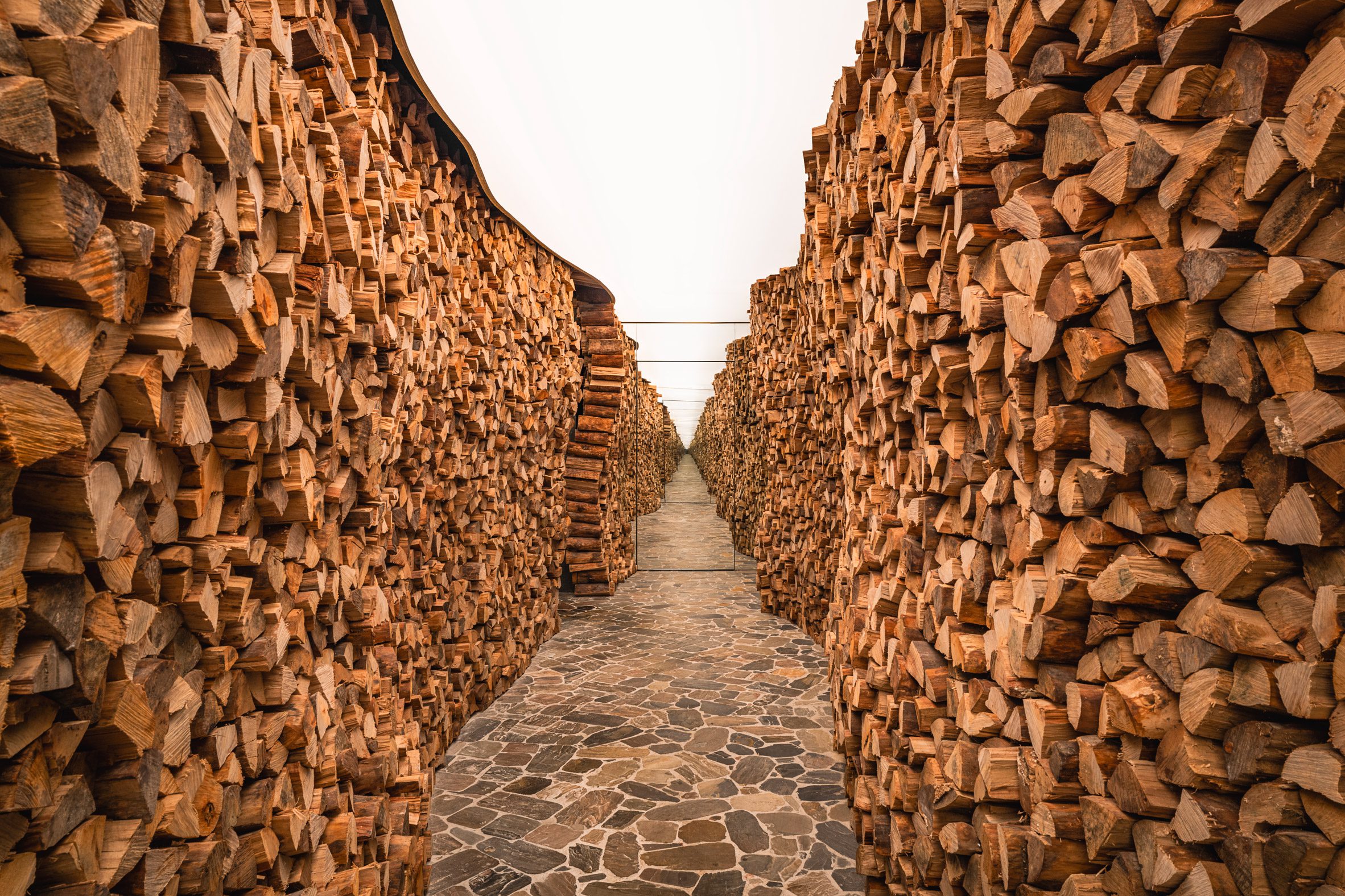 Firewood-lined entrance