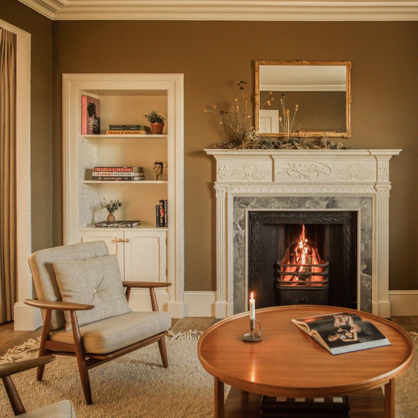 Lounge with fireplace inside Tigh Na Coille cottage by Wildland and Ruth Kramer