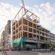 Images reveal construction of Studio Gang university in Paris built with 50 per cent natural materials