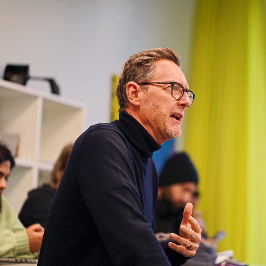 a photograph of a person in a black jumper