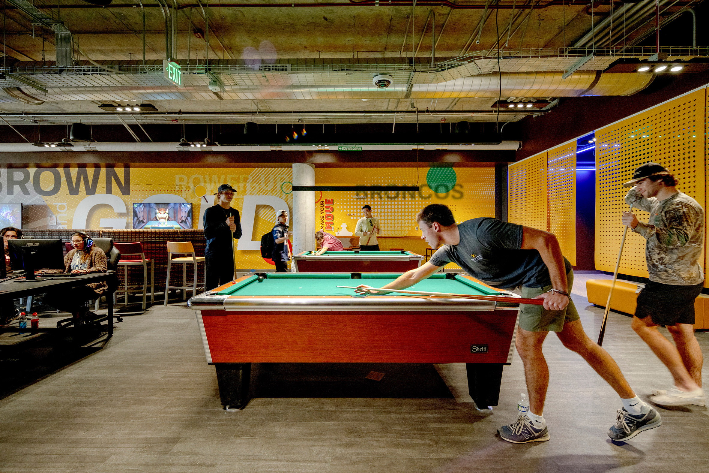 A student playing pool