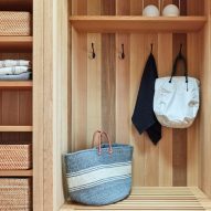 A built-in closet space with hooks