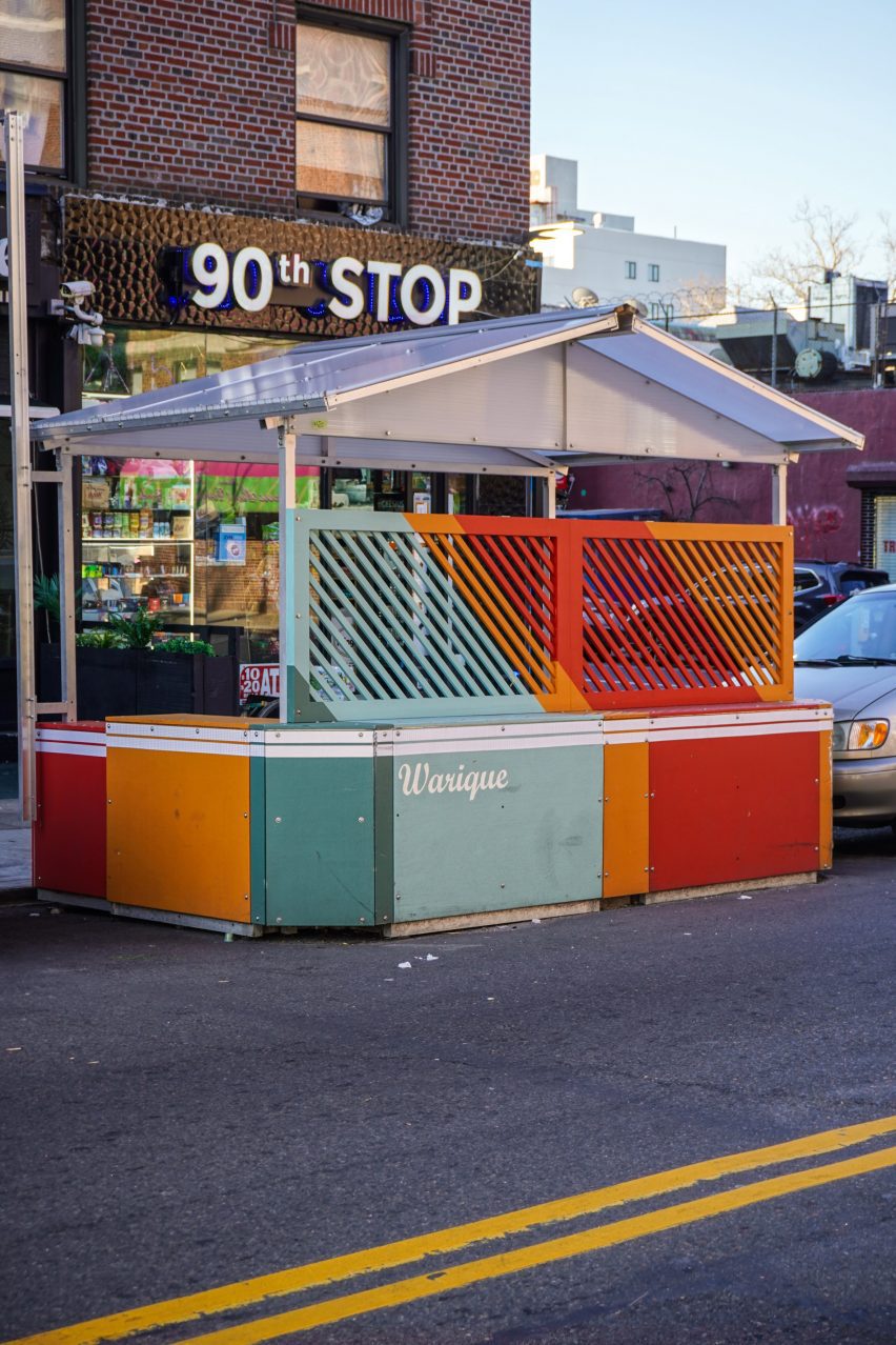 Coloured dining pavilion in New York with store in background