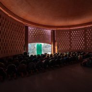 Worshippers praying in the Zebun Nessa Mosque by Studio Morphogenesis in Bangladesh