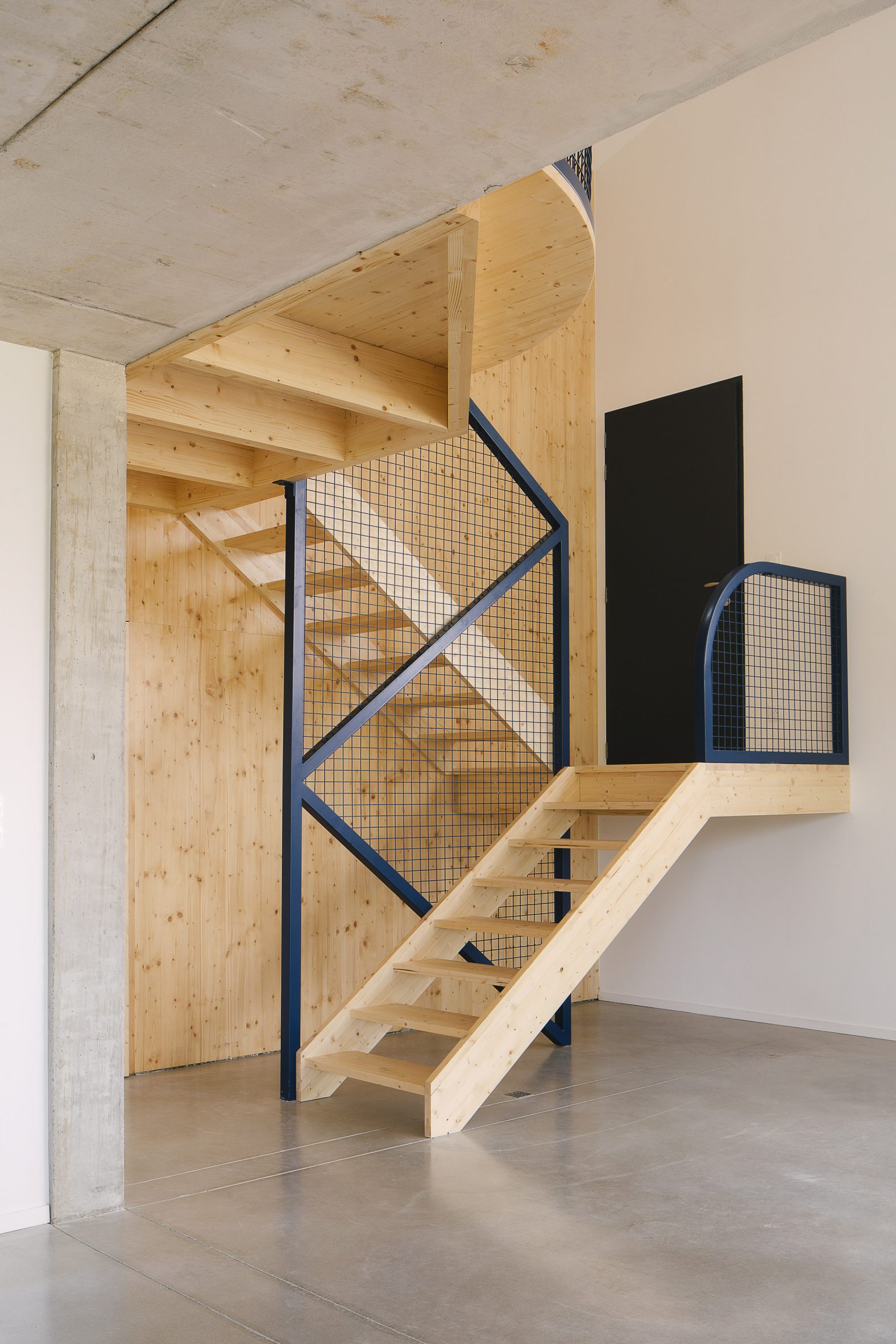 Timber staircase in a home by Barrault Pressacco