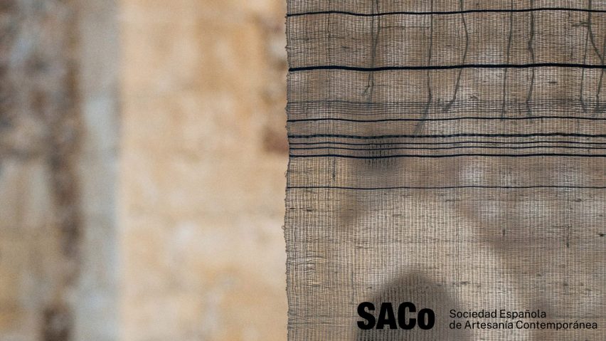 Photo of suspended textile with SACo Sociedad Española Artesanía Contemporánea logo
