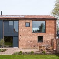 Mole Architects creates barn-like holiday home within Suffolk farmyard