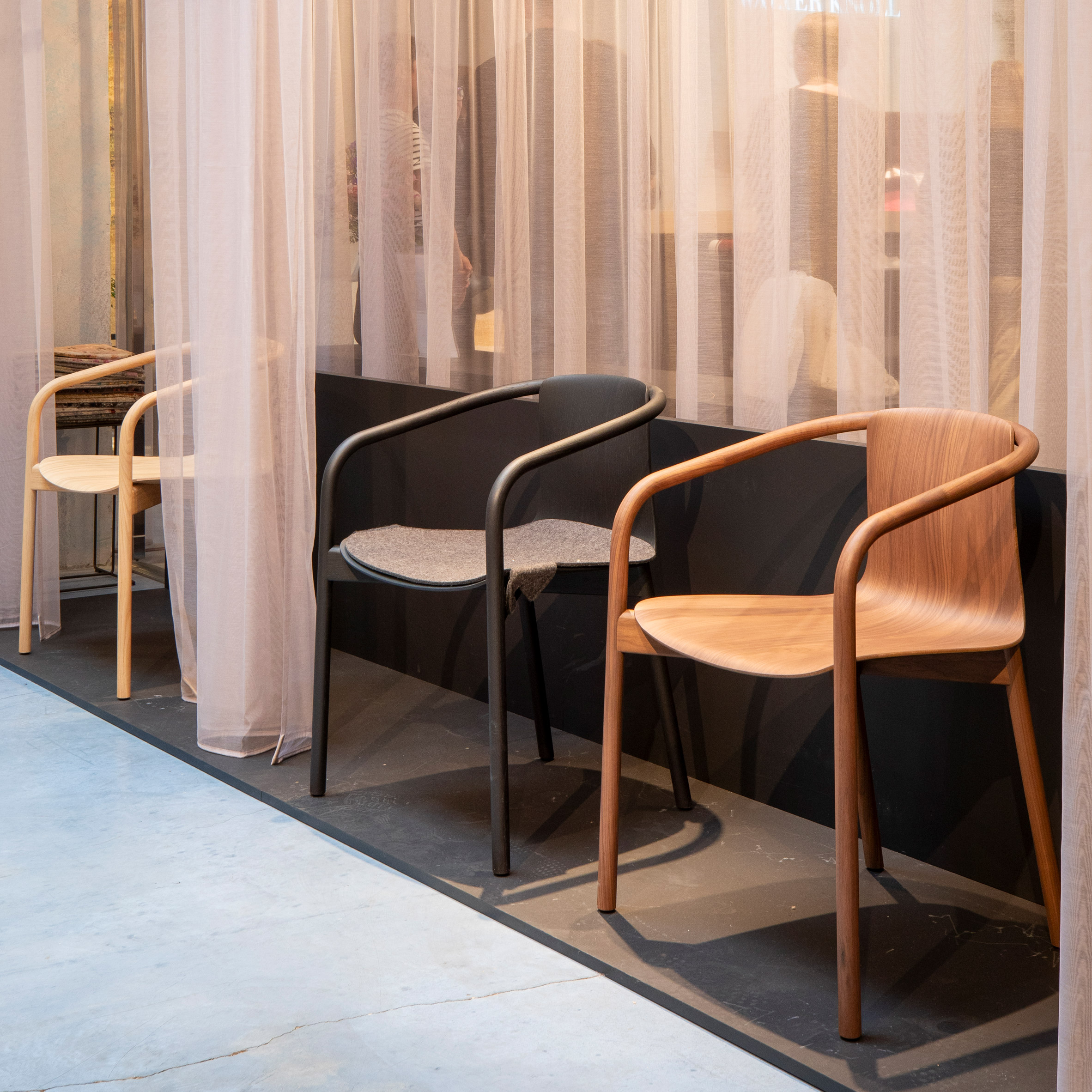 Wooden Osuu chairs by Foster + Partners