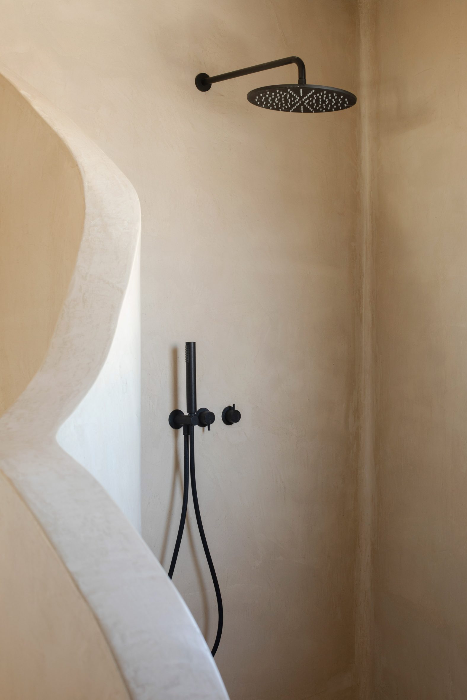 Organic-shaped shower in bathroom in Portugal