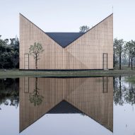 Eight buildings with inverted-pitched roofs that resemble butterfly wings