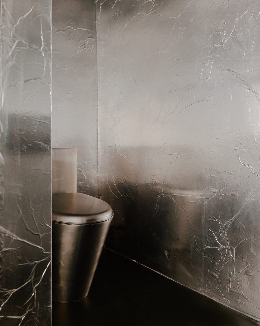 Toilet with silver walls