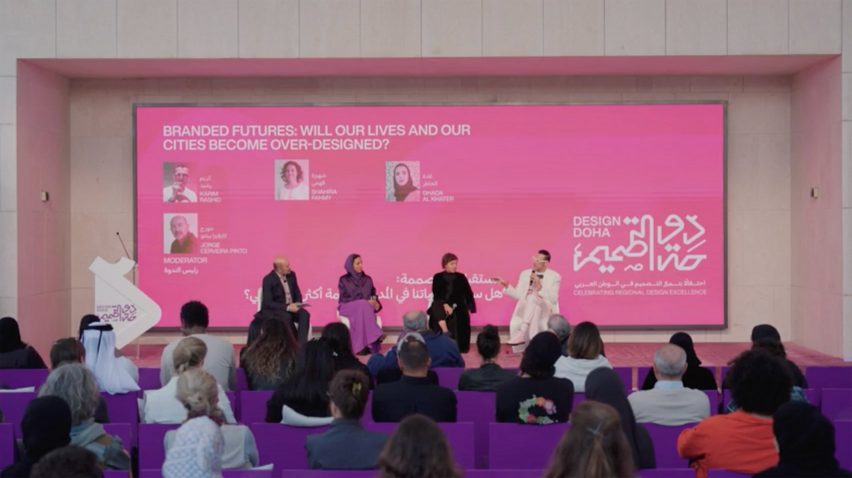 Video still of speakers on stage at the Design Doha Forum 2024 under a graphic on a screen that reads "Branded futures: will our lives and our cities become over-designed?"