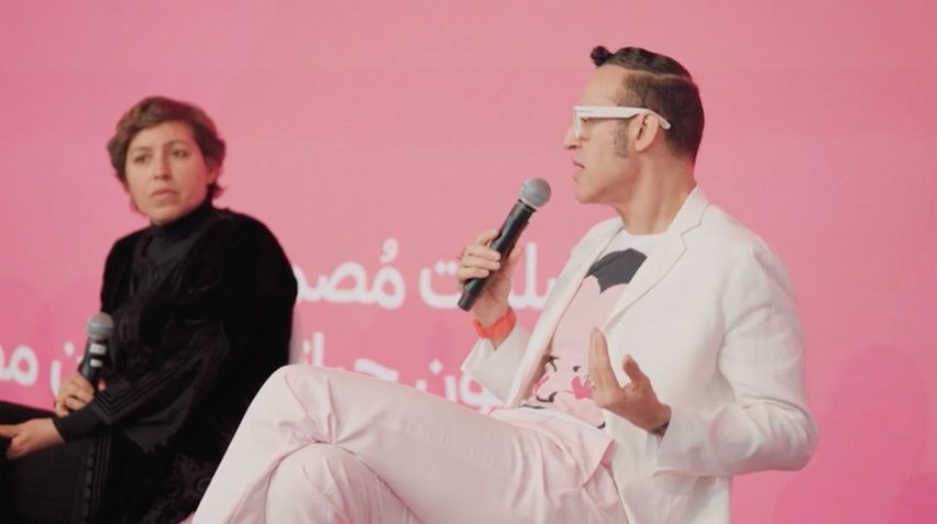 Video still of Shahira Fahmy and Kharim Rashid sitting and speaking on stage at the Design Doha Forum 2024