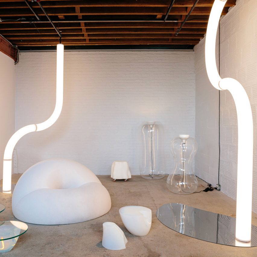 Room with white furniture and tubular lights
