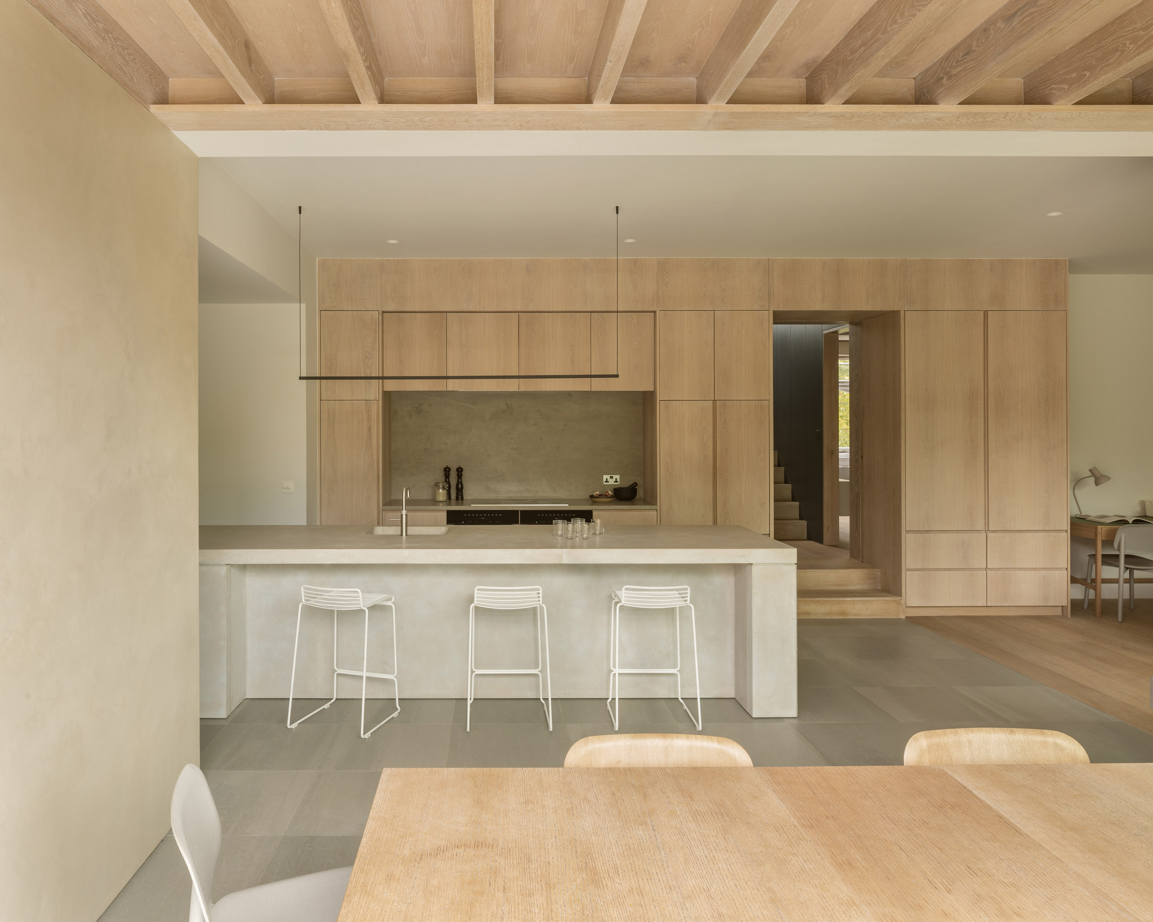 Wooden kitchen with concrete island