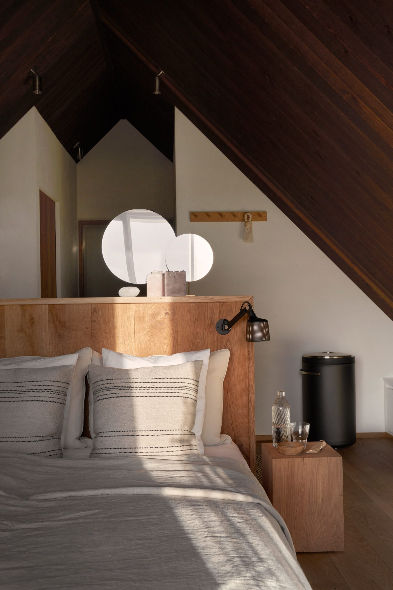 Wooden bed and gable in Vipp Cold Hawaii Guesthouse by Hahn Lavsen in Denmark