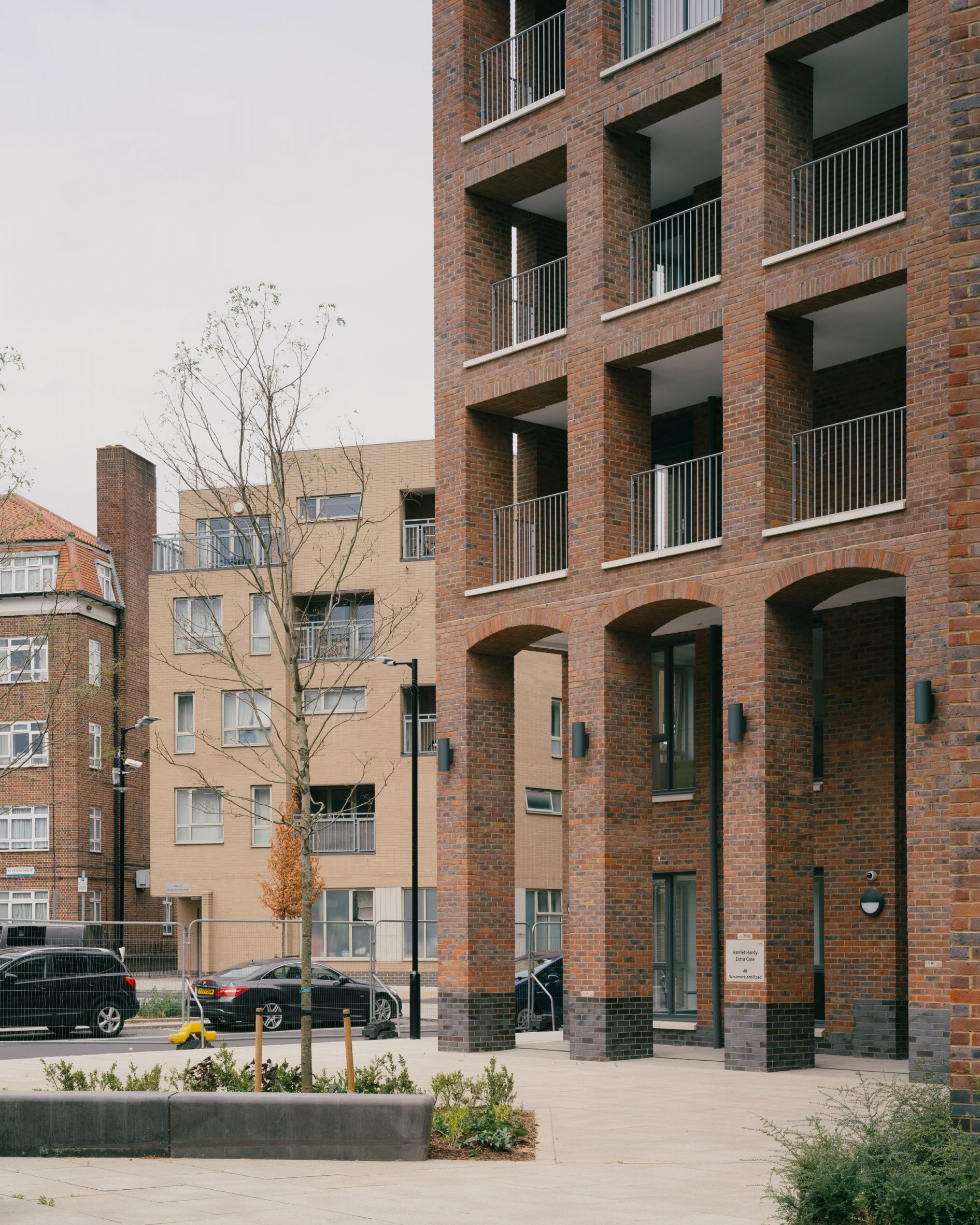Exterior courtyard at social housing development by Mae Architects