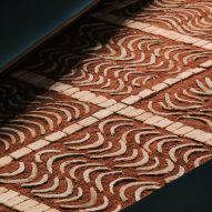 Patterned stone-and-clay floor showcases Hermès' "connection with the earth"