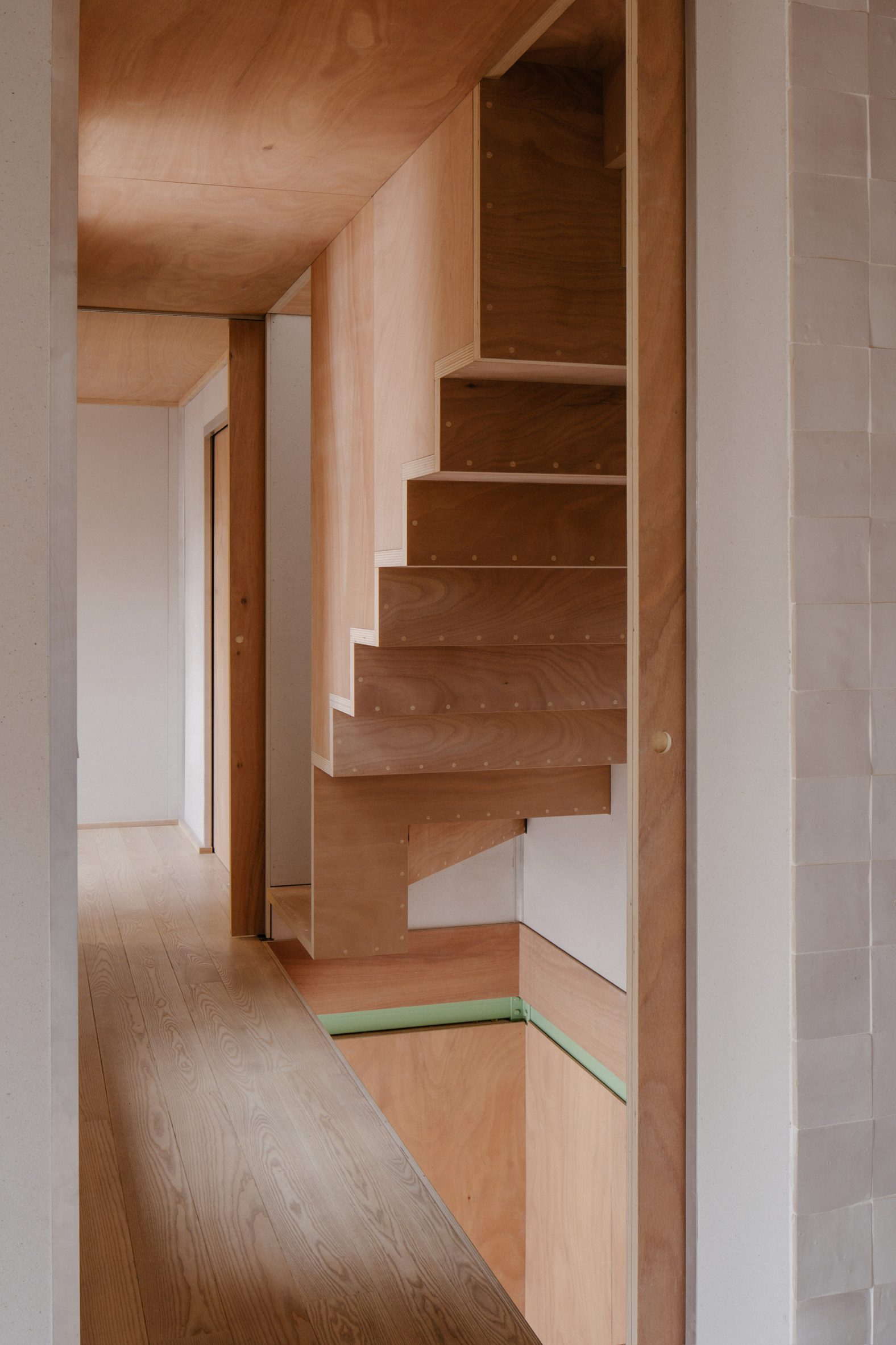 Plywood staircase in a home in Paris