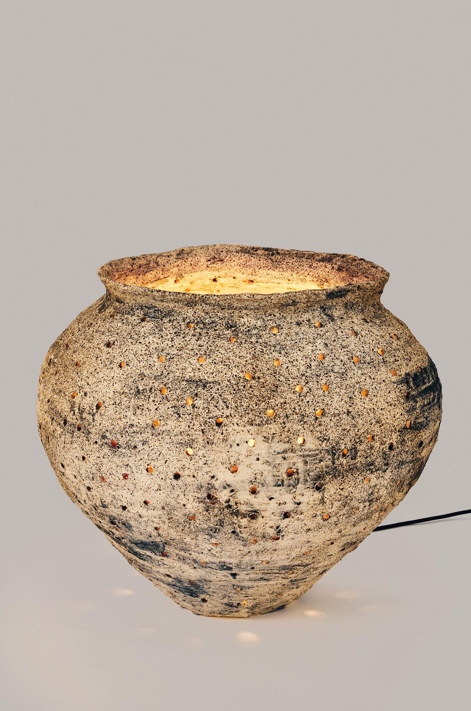 Illuminated clay pot at Loewe Lamps