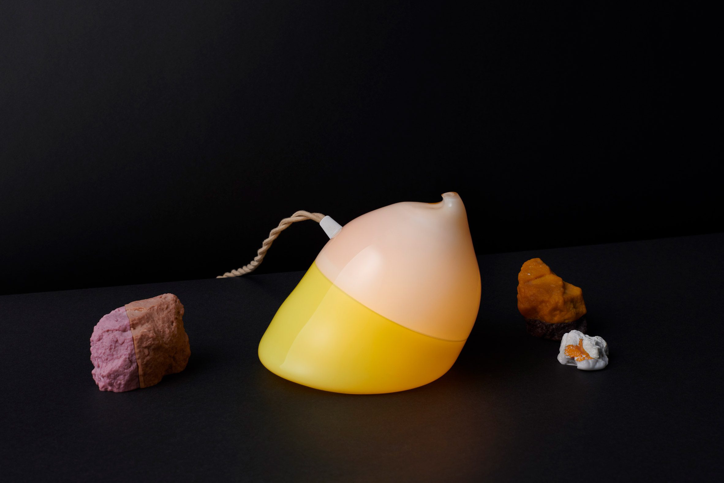 Yellow and peach-coloured light by Michiko Sakano Studio