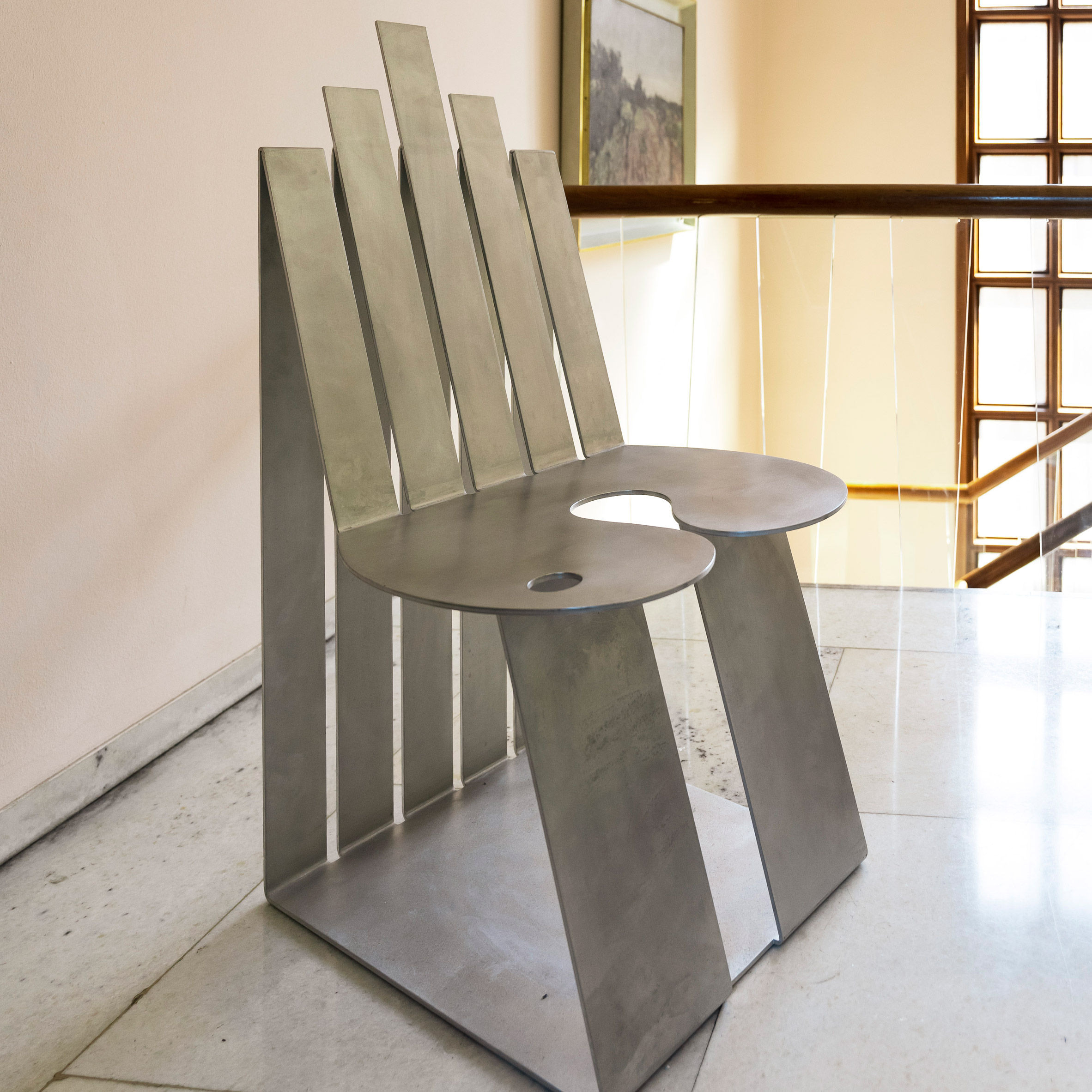 Metal chair by Kiki Goti