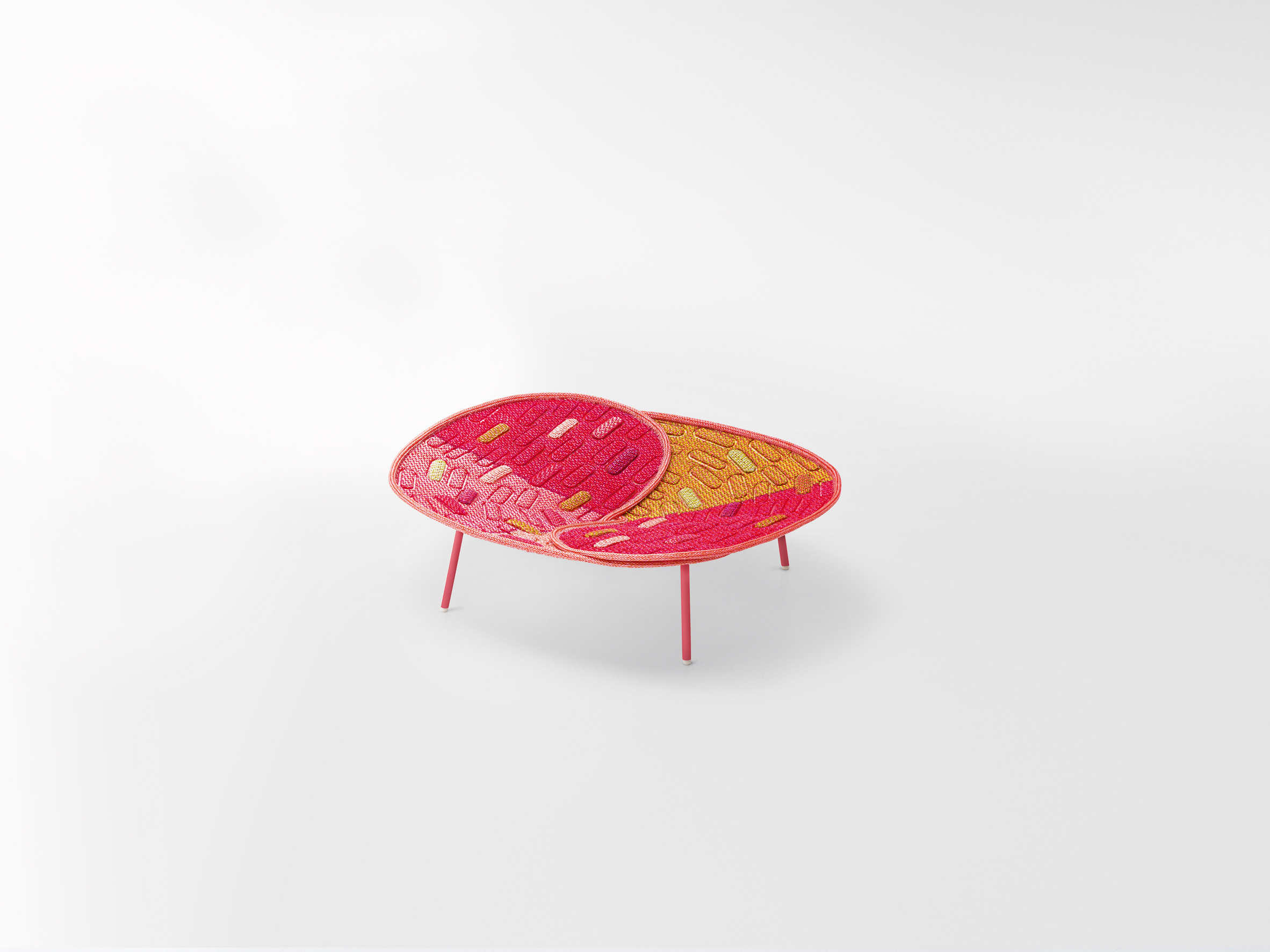 Red seat by Nendo for Paola Lenti's Hana-arashi collection