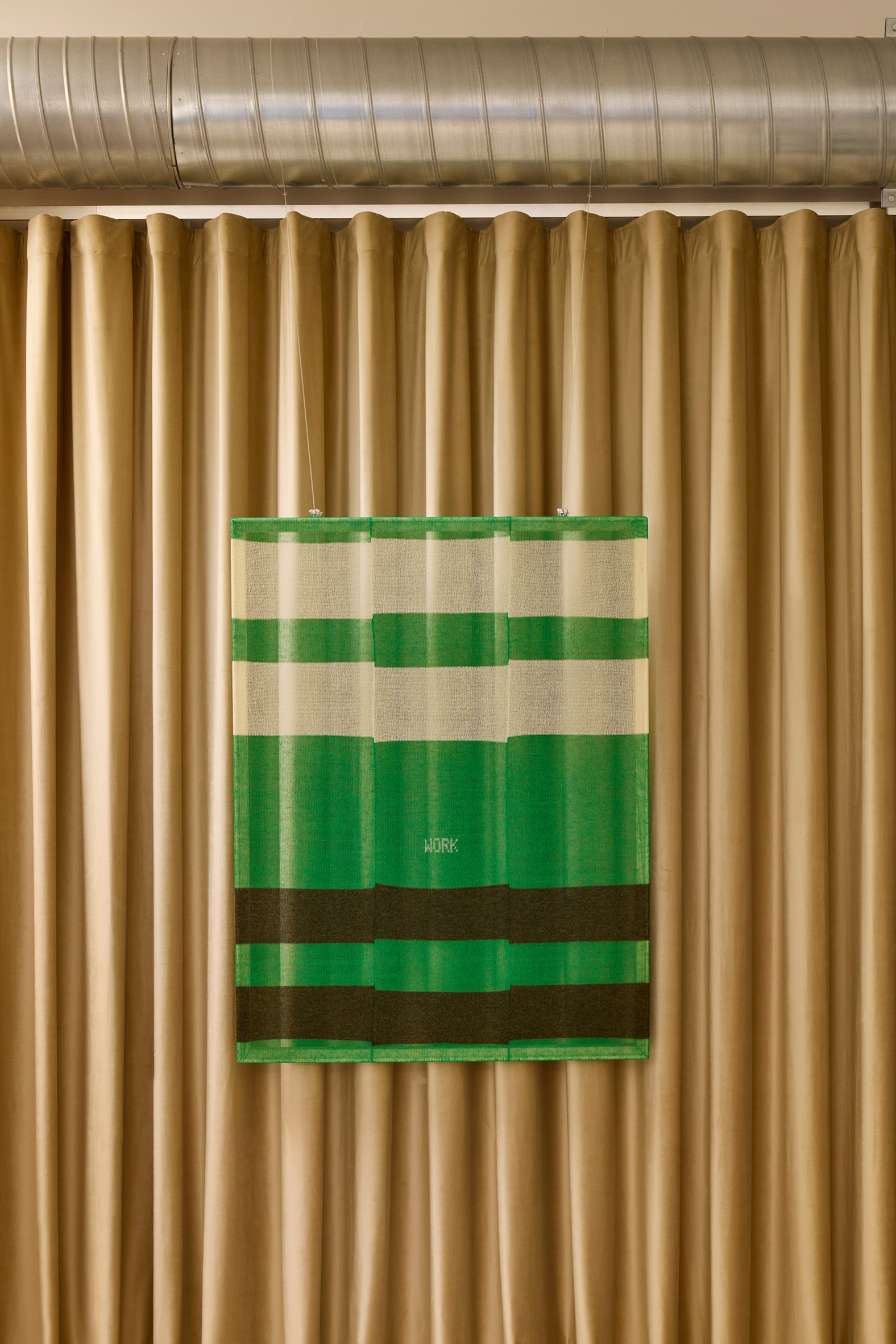 Green, brown and neutral-hued textile "painting"