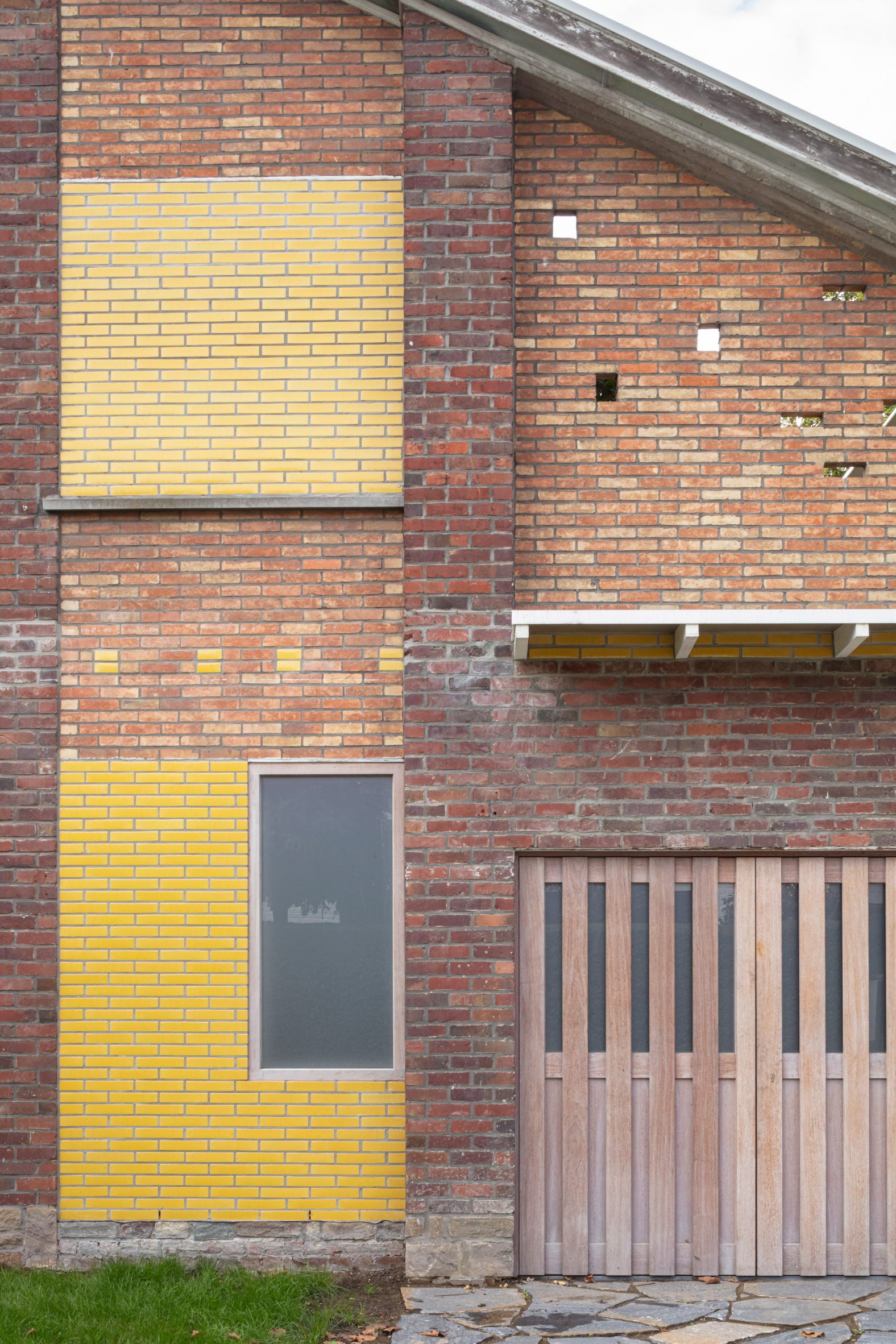 Facade with glazed yellow bricks