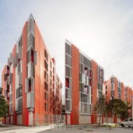 Red accents enliven social housing block on triangular plot in Barcelona
