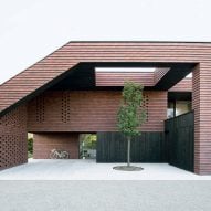 OFIS Arhitekti clads geometric home in Slovenia with red-brick tiles