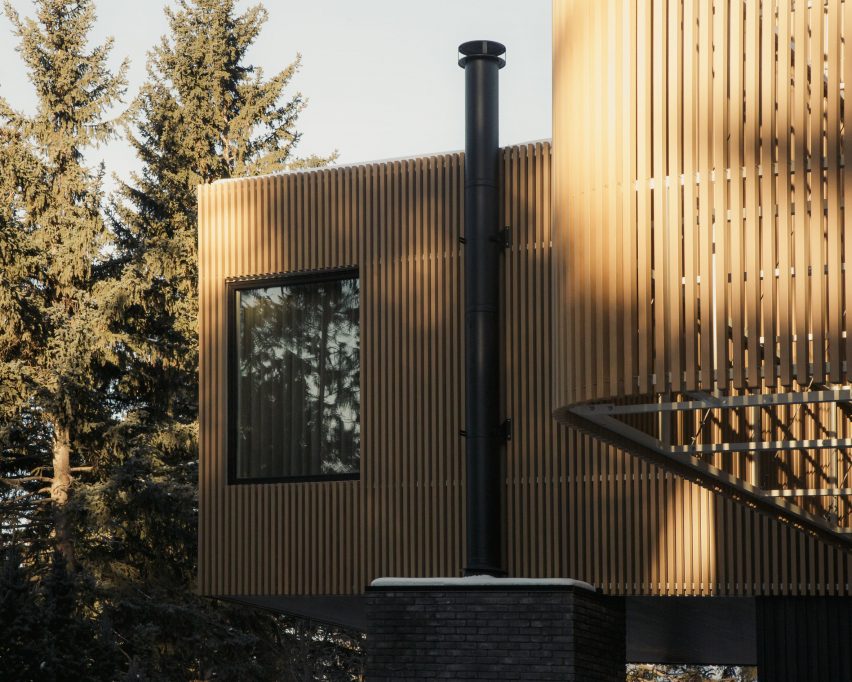 Metal chimney on wooden house
