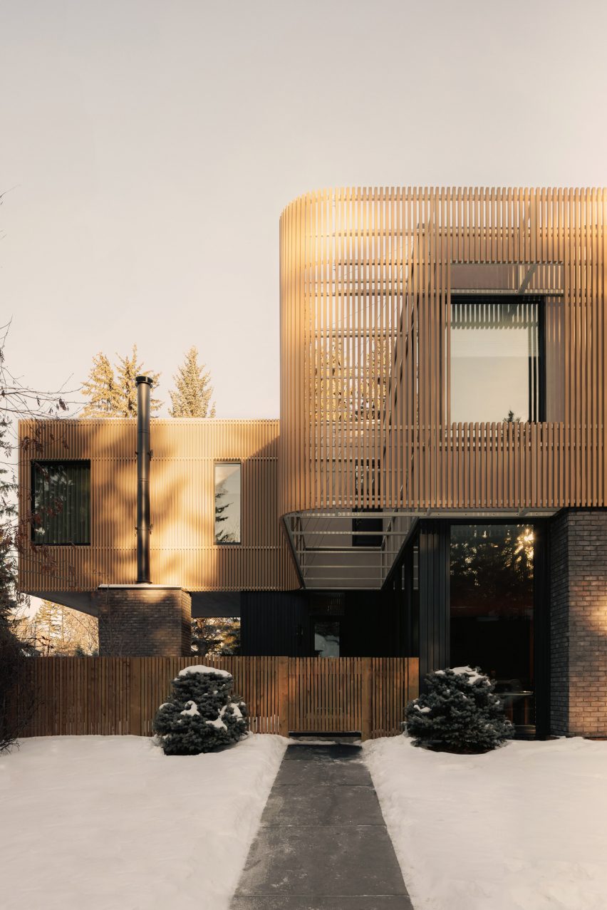 House wrapped in wooden screen