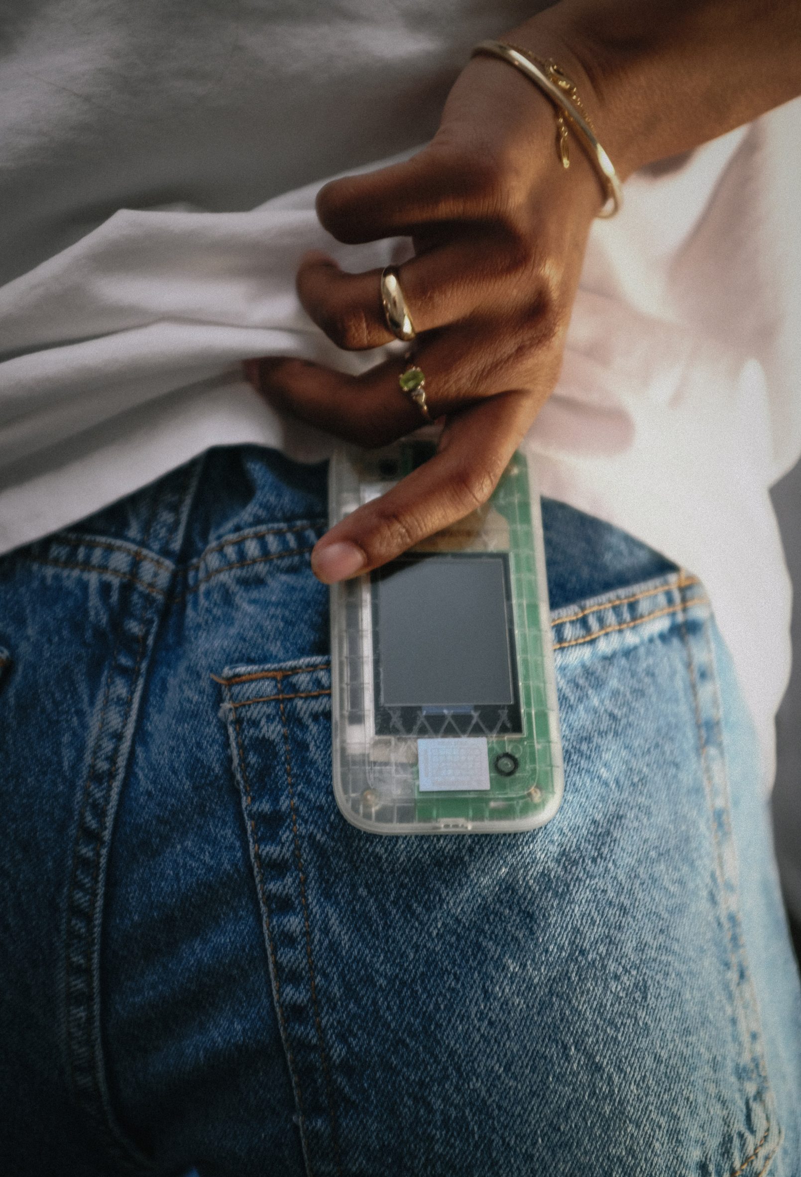 The Boring Phone in a jean pocket by Heineken and Bodega