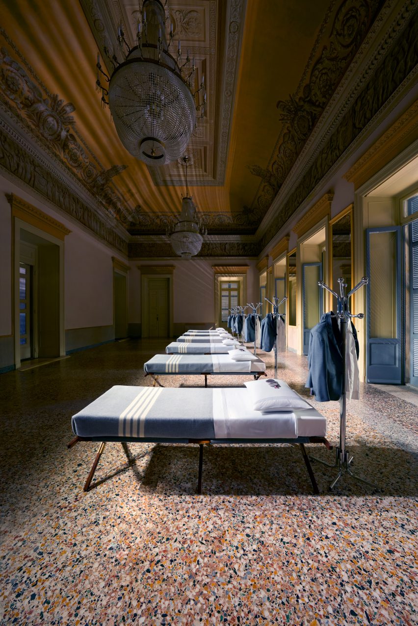 A row of beds arranged inside a neoclassical palazzo