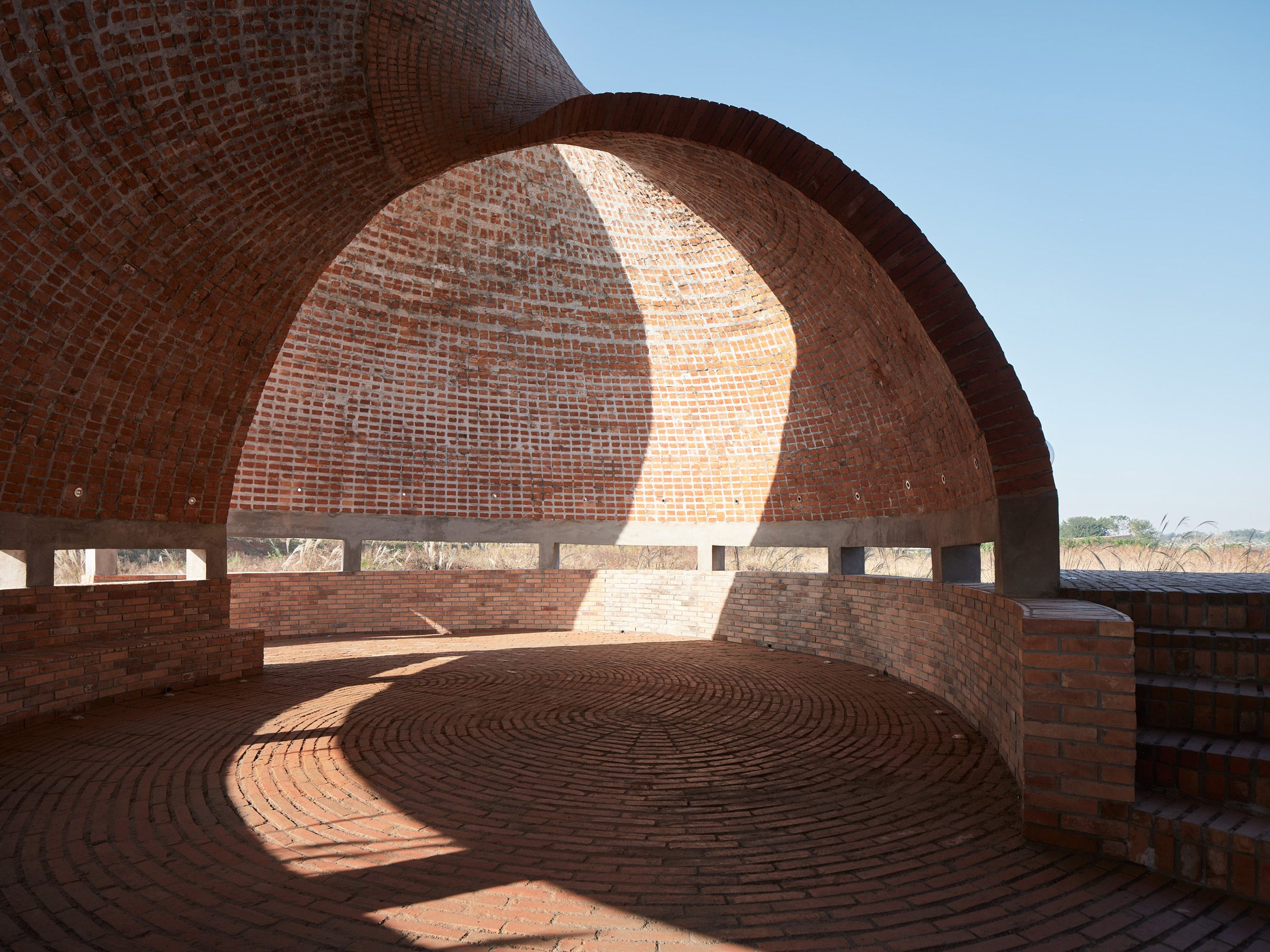 Interior view of brick structure by HCCH Studio