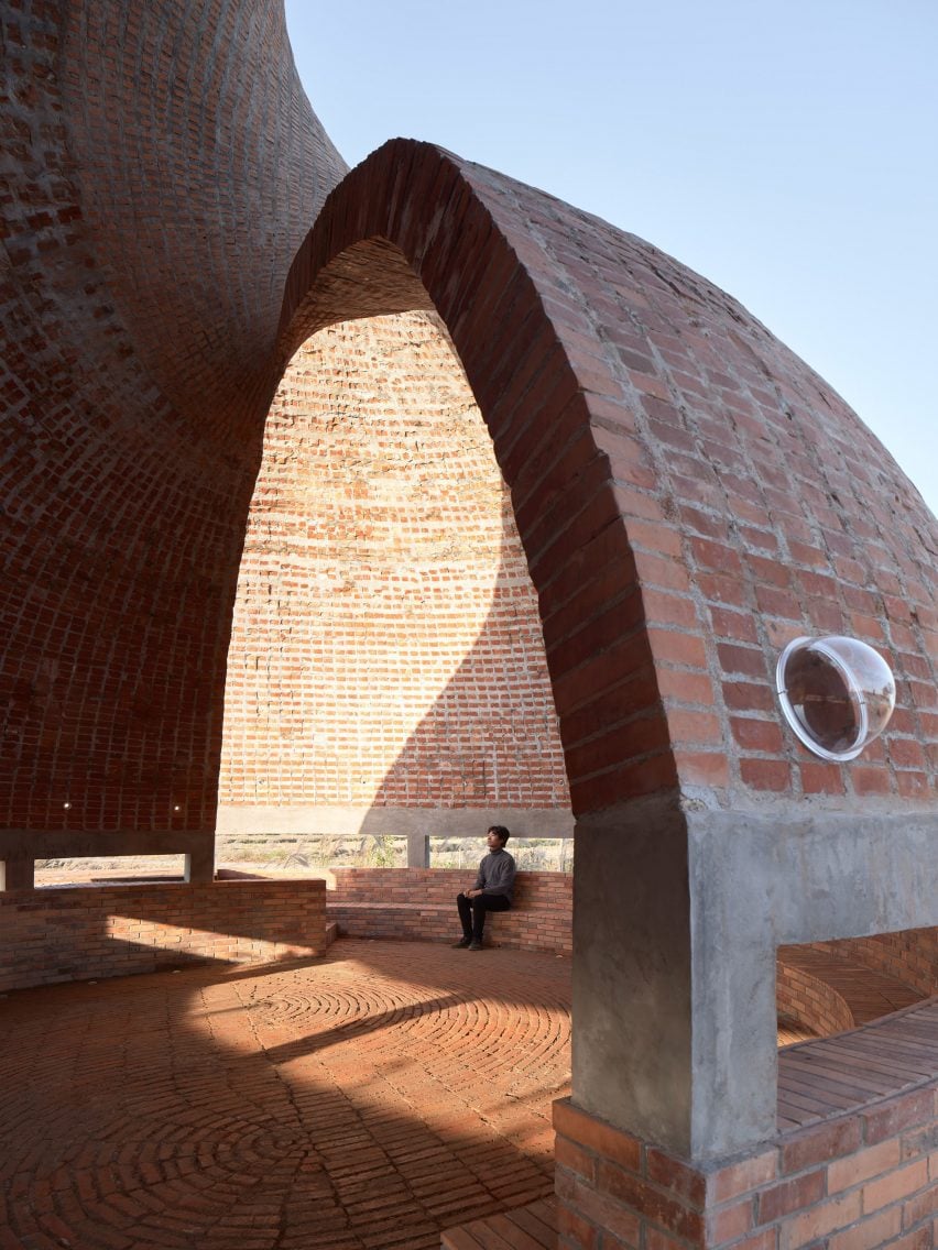 View through opening at Twisted Brick Shell Library in China