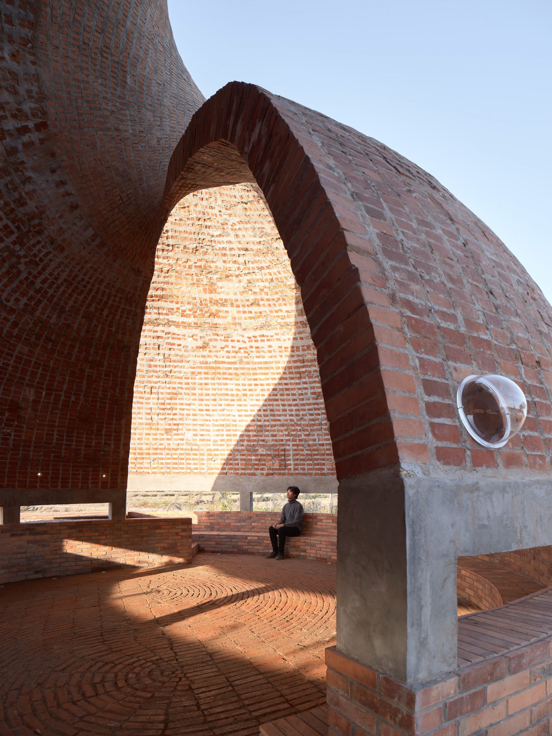 View through opening at Twisted Brick Shell Library in China